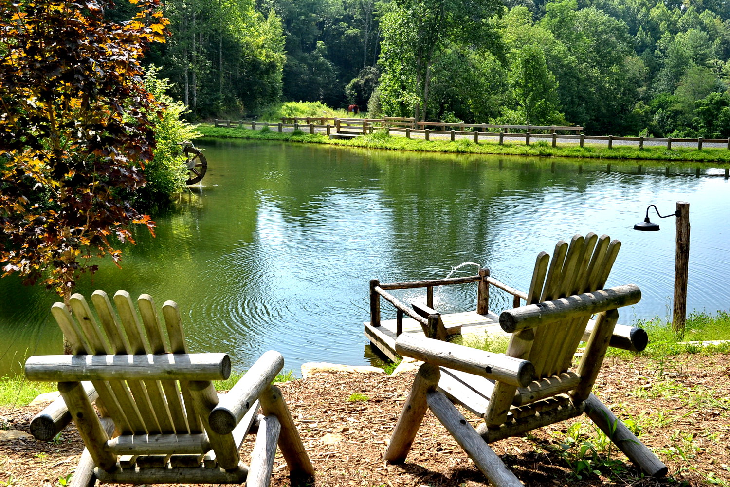 Chairs by the fishing pond below the community clubhouse